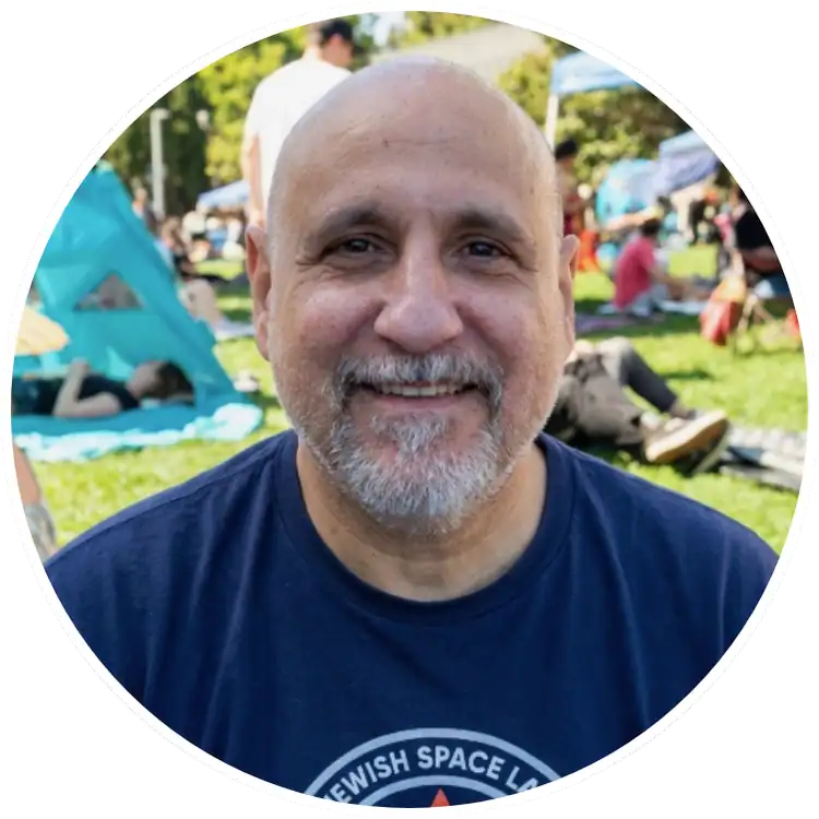 Smiling man outdoors at Dan Perata Training event in a park.